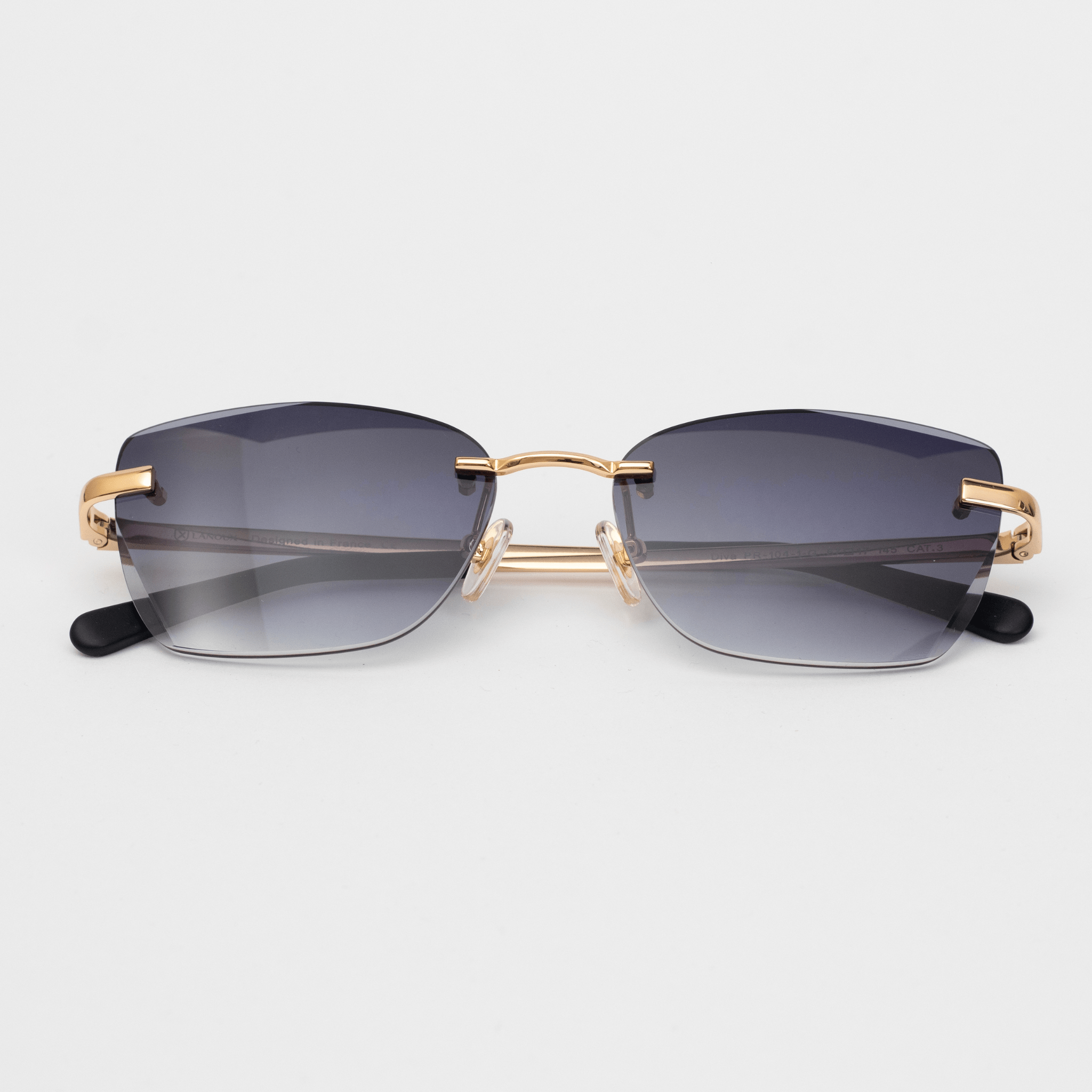 ophisticated 'Diva' model sunglasses featuring gradient grey lenses that provide a seamless transition from a darker top to a lighter bottom. The frame showcases 18k gold-plated hardware, offering an elegant contrast against the grey lenses, complete with comfortable black arm ends for a secure fit