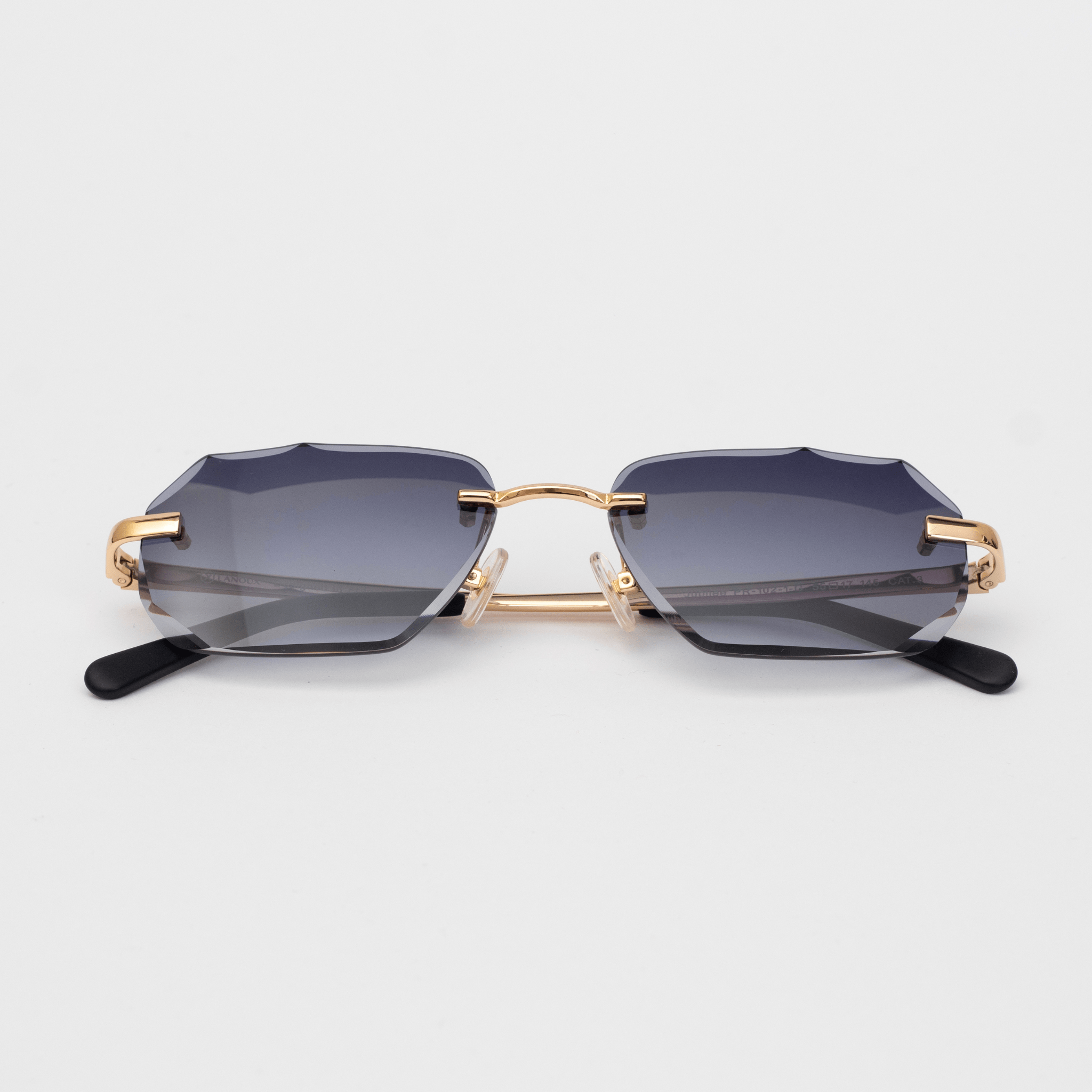 Model Jubilee diamond-cut sunglasses featuring a unique faceted grey lens design, with 18K gold-plated accents on the frame and hinges, presented on a white background.