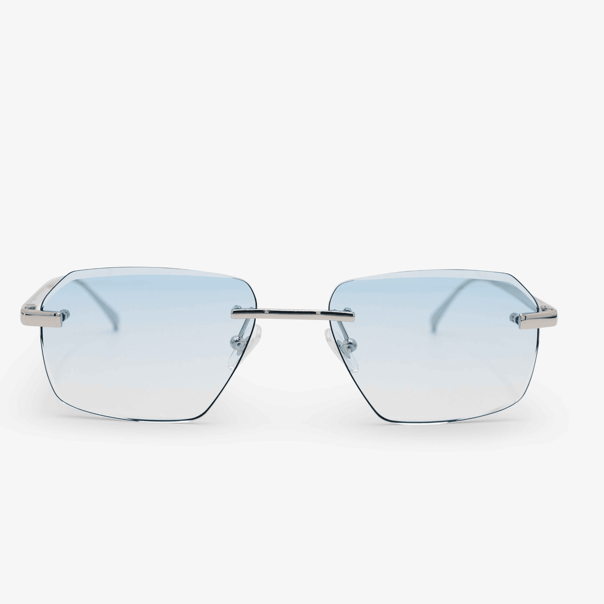 Model Sancy sunglasses with a clean, diamond-cut rimless design and sky blue lenses, featuring elegant sterling silver frame accents, presented on a pure white background.