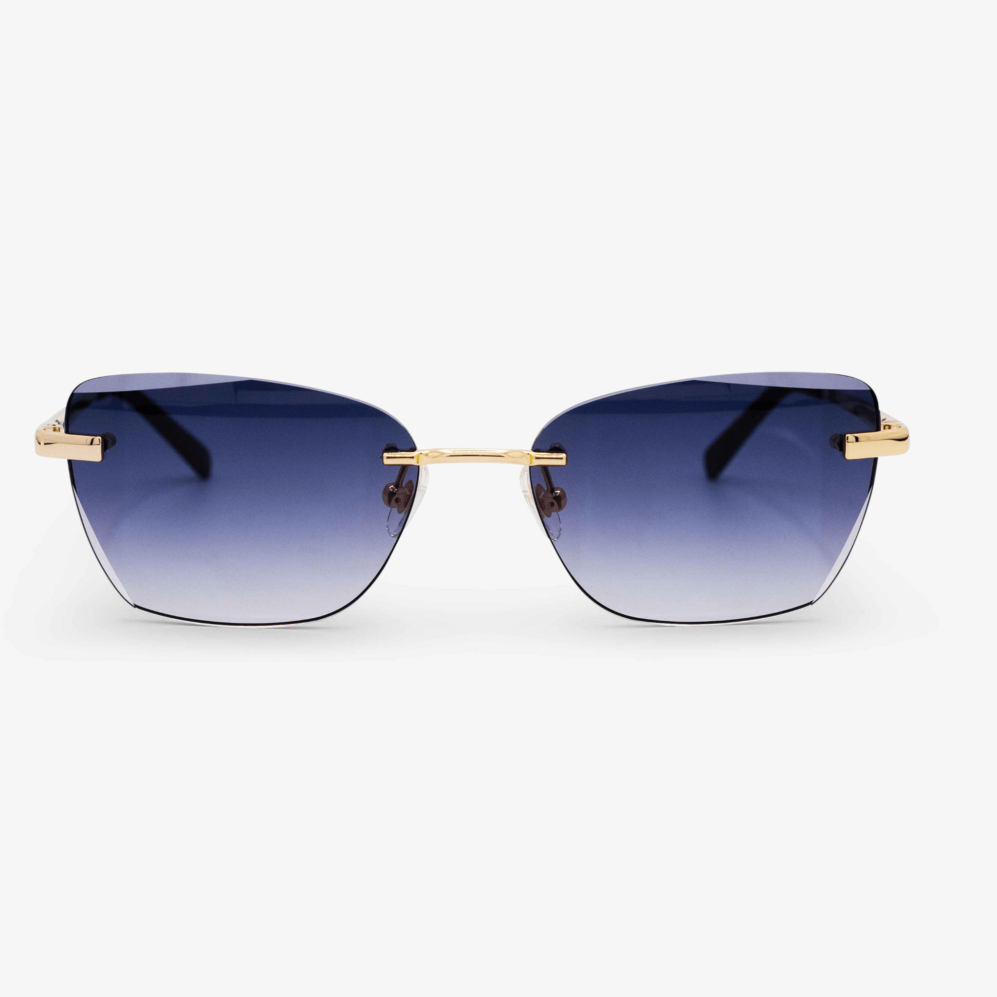 The 'Diva' model sunglasses in gradient grey offer a harmonious blend of style and sophistication. These rimless, rectangular-shaped lenses transition smoothly from a darker shade at the top to a lighter grey at the bottom, complemented by the subtle sheen of 18k gold details on the bridge and temples.